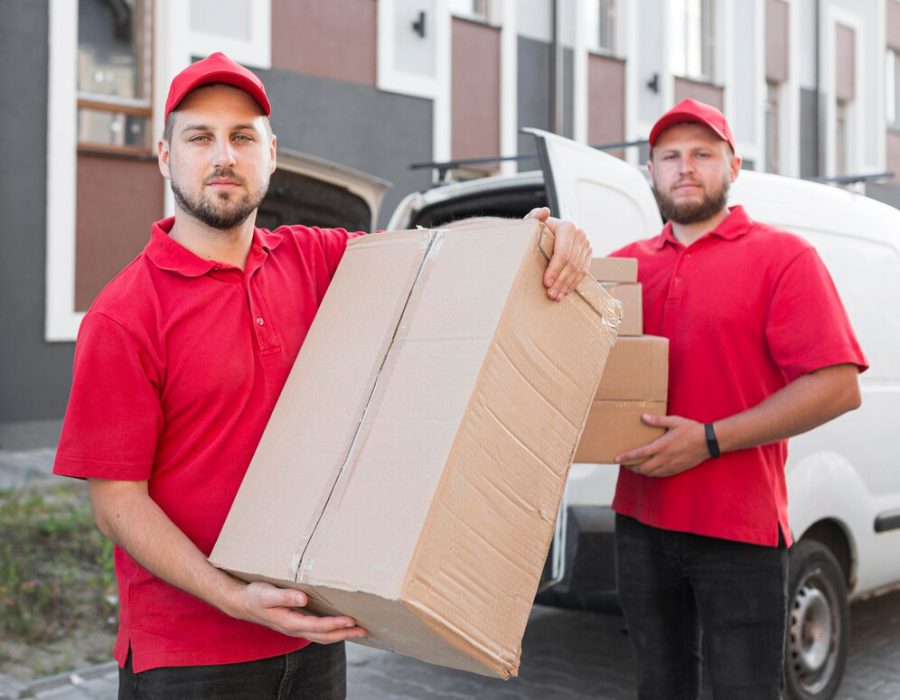 front-view-delivery-man-with-packagaes_23-2148684719