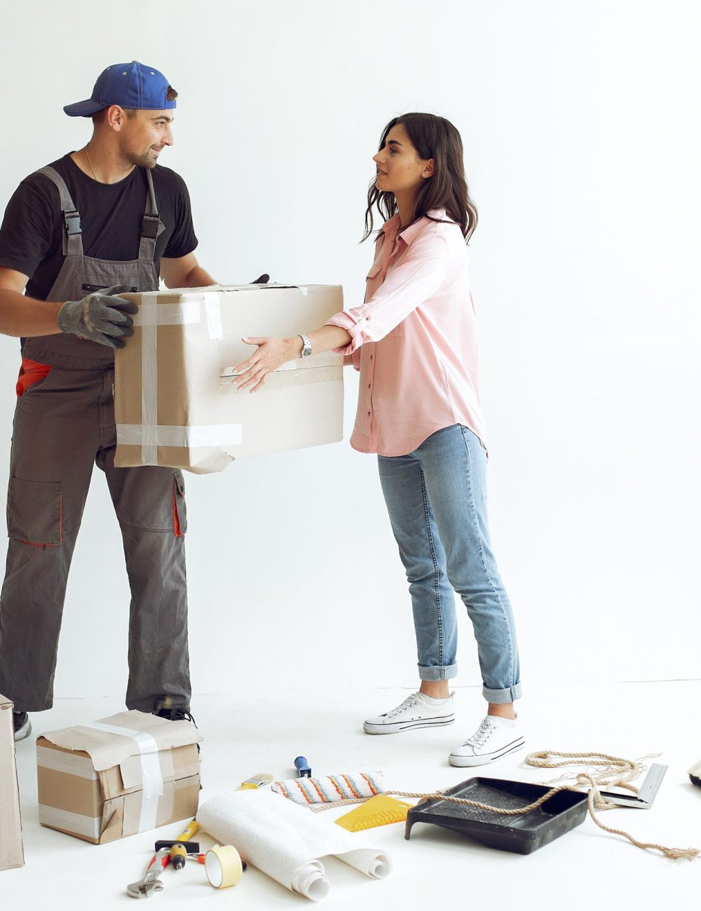 Family repairs. Couple at home. Woman in a pink blouse